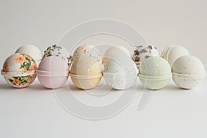 A collection of handmade bath bombs displayed against a white background,top view