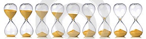 Collection of hourglasses with yellow sand showing the passage of time