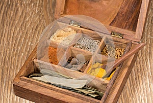 Collection of Indian spices in wooden box