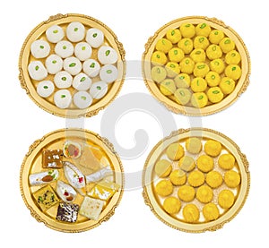 Collection of Indian Sweet Food Rasgulla, Coconut Laddu, MIx Sweets or Modak Laddu in Golden Plate