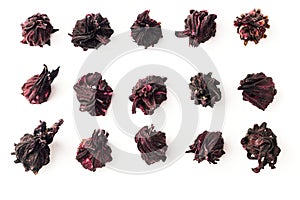 Collection of karkade tea calyces. Separated dried hibiscus flowers. Set of red hibiscus petals isolated on a white background.