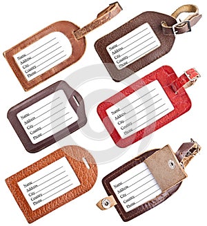 Collection of leather luggage tags isolated on white