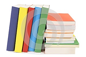 Collection of library books, stacked, leaning, isolated white background