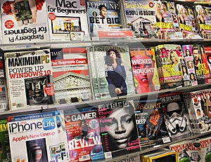Collection of magazines on bookstore shelf