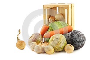 Collection of many fresh winter vegetables in a wooden crate