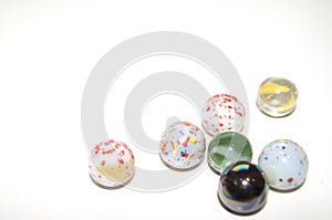 Collection of marbles made of steel, glas and aked clay