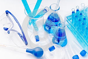 Collection of medical flasks on a blue background.Science glass flask blue chemistry laboratory banner background