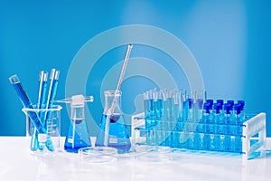 Collection of medical flasks on a blue background.Science glass flask blue chemistry laboratory banner background