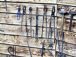 Collection of metal tools in smithery photo