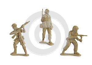 Collection of miniature toy soldiers with guns isolated on white background with clipping path.