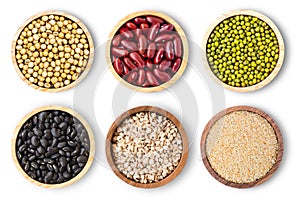 Collection of mix bean  red kidney, green mung, black bean, soy beans, sesame and millet  in wooden bowl isolated on white