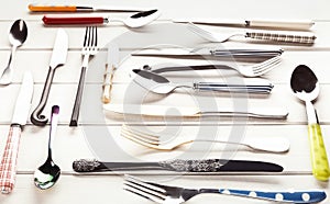 Collection of modern and antique cutlery, top view