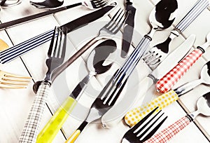 Collection of modern and antique cutlery, top view