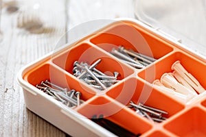 Collection of nails, screws and bolts in plastic box