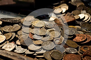A collection of old coins kept at a roadside vendor`s shop in old delhi photo