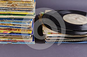 A collection of old comics, magazines, and vinyl records on a gray background