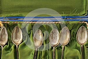 Collection of old silver spoons in velvet box