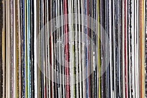 Collection of old vinyl records stacked. Detail of album cover