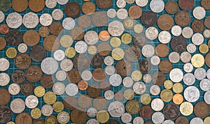 Collection of old worldwide coins viewed from above.