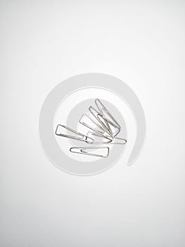 Collection of paper clips isolated on white background.