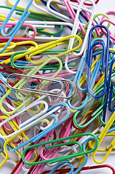 A collection of paperclips on a white surface