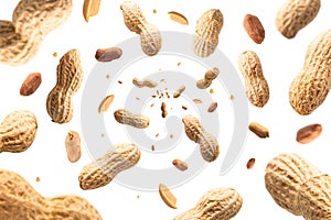 Collection of peanuts falling isolated on white background. Selective focus