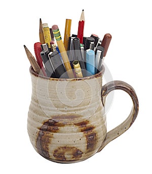 Collection of pens and pencils in a mug