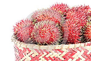 Collection of perfectly ripe rambutan fruit in bamboo basket