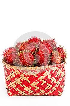 Collection of perfectly ripe rambutan fruit in bamboo basket