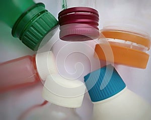 A collection of plastic bottles and caps with various shapes and colors