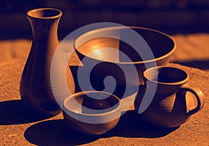 Casts strong shadows, highlighting the shape and texture of the