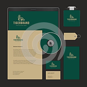 Collection realistic business elements green vintage tiger logo template placed desk top view vector photo