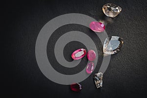 Collection of Red ruby and topaz, Precious stones for jewellery on black matte paper background