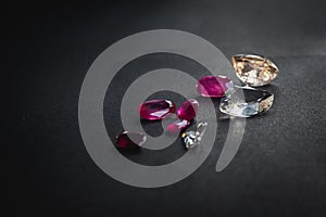 Collection of Red ruby and topaz, Precious stones for jewellery on black matte paper background