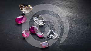 Collection of Red ruby and topaz, Precious stones for jewellery on black matte paper background