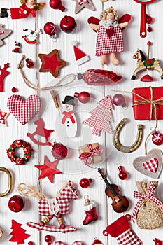 Collection of red and white checkered christmas decoration on wo