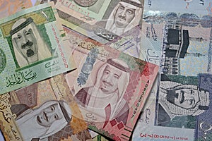 Collection of Saudi Arabia money background, different Saudi riyals collection of 500, 100, 10, 5 and 1 riyal, selective focus