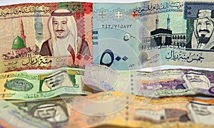 Collection of Saudi Arabia money background, different Saudi riyals collection of 500, 100, 10, 5 and 1 riyal, selective focus