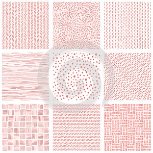 Collection of seamless patterns. Set of pink and white prints for textiles. Handmade. Hand drawn geometric ornament. Doodle style.