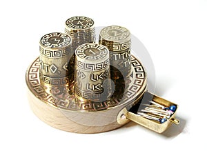 Collection set ot four thimbles on base with box for needles. Thimbles with etching with Greek aphorisms. photo