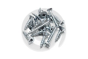 Collection of silver screws arranged on a white background for construction tasks
