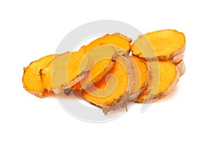 Collection of sliced fresh Organic Long Turmeric (Curcuma longa).