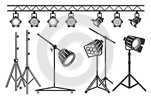Collection of studio lighting equipment and stands spotlight stage light