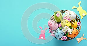 Collection of stylish colors eggs with flowers for Easter celebration on blue background.