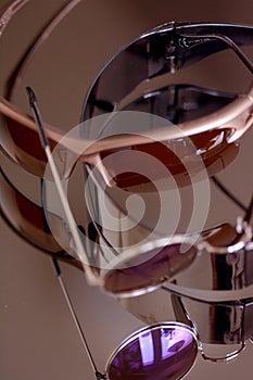 Collection of sunglasses on big reflection mirror