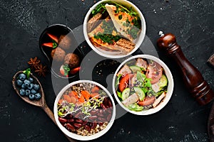 Collection of take away foil boxes with healthy food. Set of containers with daily meals. Top view.