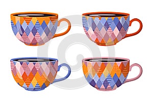Collection of tea cups with patchwork ornament. Vector set of four mugs isolated on white background