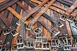 Collection of unbranded belts on a market stand