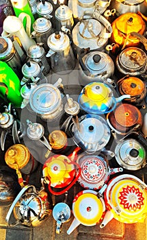 A collection of unique teapots at a second-hand market in Saudi Arabia.