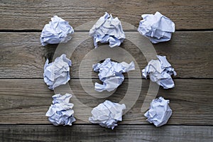 Collection of various crumpled paper on wood table background